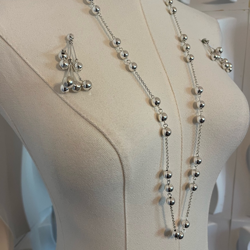 Silver toned beaded necklace and matching cluster earrings set